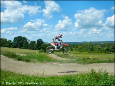 Honda CRF Dirt Bike jumping at Frozen Ocean Motorsports Complex Track