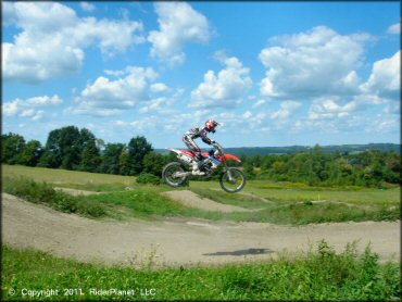 Honda CRF Dirt Bike catching some air at Frozen Ocean Motorsports Complex Track