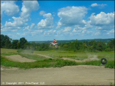 Honda CRF Motorcycle jumping at Frozen Ocean Motorsports Complex Track