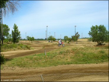 Honda CRF Dirt Bike catching some air at Riverfront MX Park Track