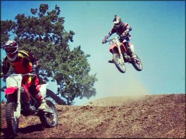 Honda CRF Dirt Bike jumping at Zaca Station MX Park Track