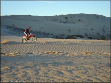 Honda CRF Trail Bike popping a wheelie at Rasor OHV Area