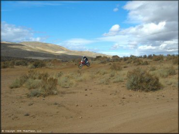 Honda CRF Trail Bike getting air at Sunridge Track OHV Area