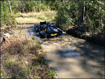 OHV traversing the water at Up The Creek Acres Trail