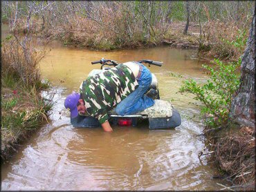 Quad in the water at Sand Hill ATV OHV Area