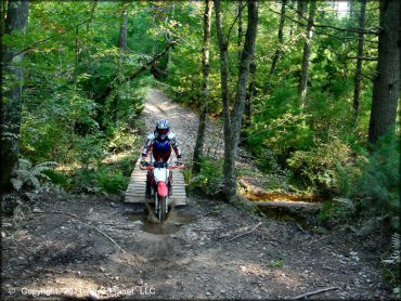 OHV traversing the water at Freetown-Fall River State Forest Trail