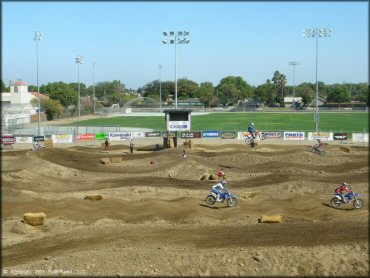 Yamaha YZ Off-Road Bike jumping at Los Banos Fairgrounds County Park Track