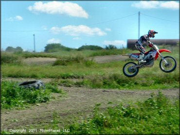 Honda CRF Dirt Bike jumping at Frozen Ocean Motorsports Complex Track
