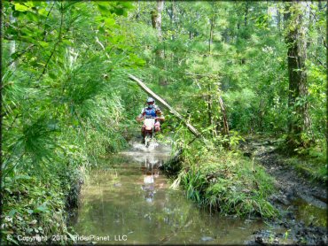 OHV traversing the water at Wrentham Trails