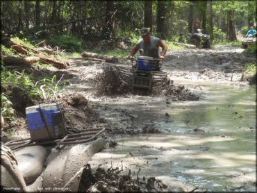 OHV traversing the water at ATV Mud Fury Trail