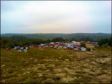 Large group of trucks and campers parked in main staging area.