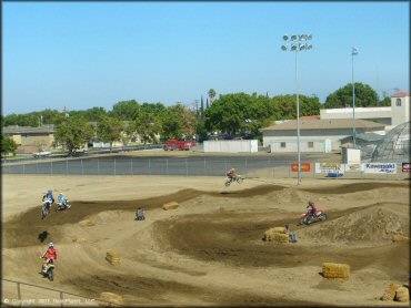 Honda CRF Dirt Bike jumping at Los Banos Fairgrounds County Park Track