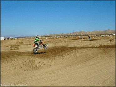 KTM Trail Bike jumping at Cal City MX Park OHV Area