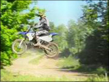 Yamaha YZ Motorbike jumping at Martin MX Park Track