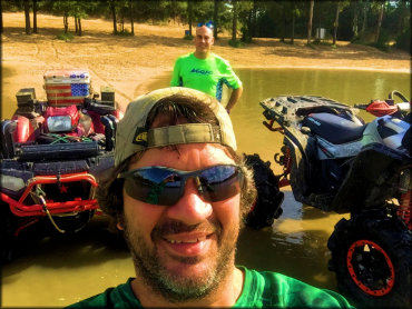 Two ATV riders enjoying the beach area at Xtreme Off-Road Park.