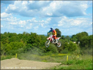 Honda CRF Dirt Bike jumping at Frozen Ocean Motorsports Complex Track