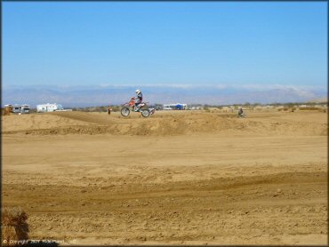 Honda CRF Dirt Bike catching some air at Cal City MX Park OHV Area