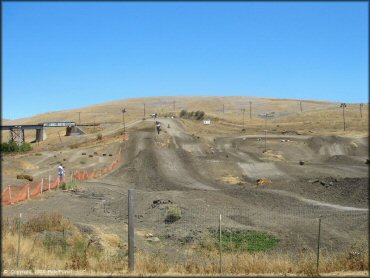Motorcycle catching some air at Club Moto Track