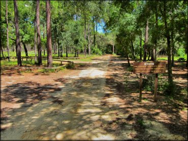 Campground entrance with brown forest service signage.