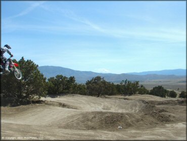 Honda CRF Motorbike catching some air at Stead MX OHV Area