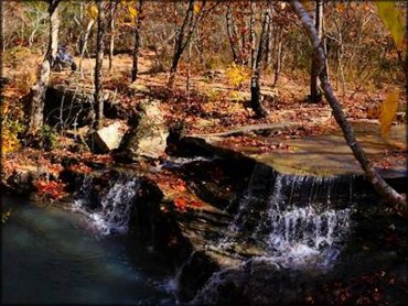 UTV overlooking waterfall.