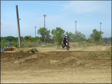 Honda CRF Dirt Bike jumping at Riverfront MX Park Track