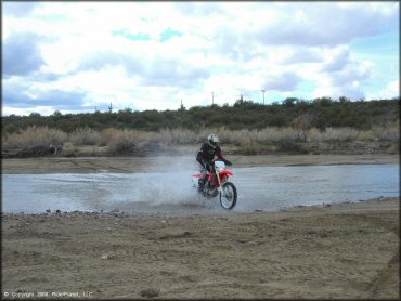 Honda CRF Motorcycle getting wet at Black Hills Box Canyon Trail