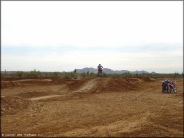Honda CRF Motorcycle catching some air at Canyon Motocross OHV Area