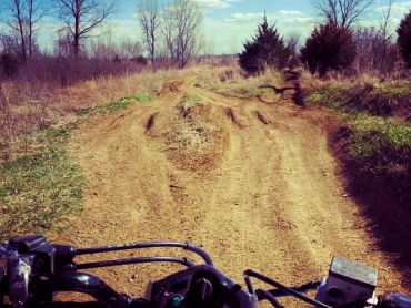 Photo of trail taken from the seat of an ATV.