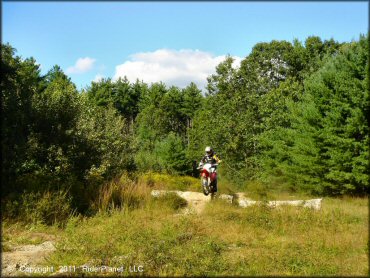 Honda CRF Dirtbike jumping at Hodges Village Dam Trail