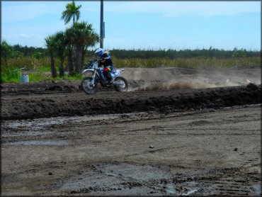 Young woman on Yamaha motocross bike.