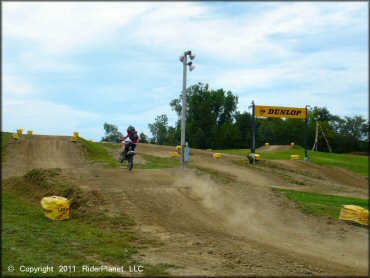 KTM Motorbike catching some air at Area 51 Motocross OHV Area