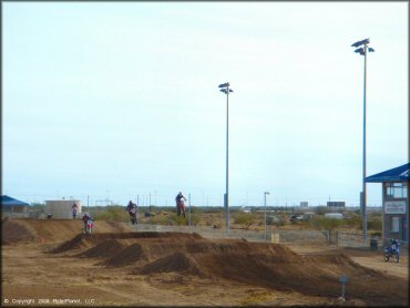 Honda CRF Dirt Bike getting air at M.C. Motorsports Park Track