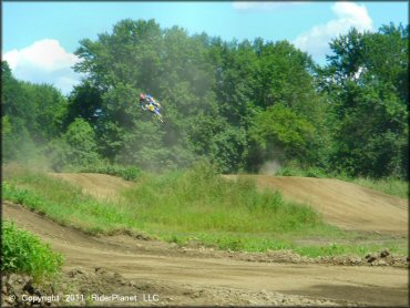 Yamaha YZ Motorcycle catching some air at Connecticut River MX Track