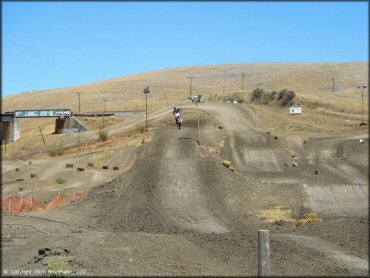 Honda CRF Dirtbike catching some air at Club Moto Track