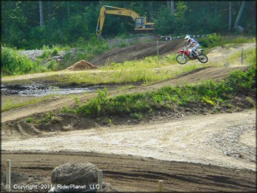 Honda CRF Motorbike jumping at Crow Hill Motor Sports Park L.L.C OHV Area