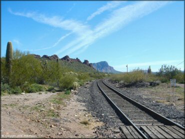 Railroad tracks going through the Sonoran Desert.