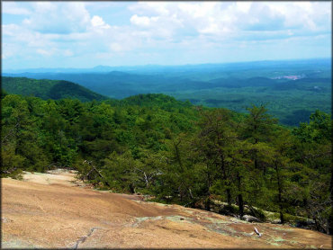 Scenic view of valley and surrounding mountains.