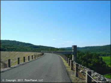 A close up photo of the paved main entrance road.