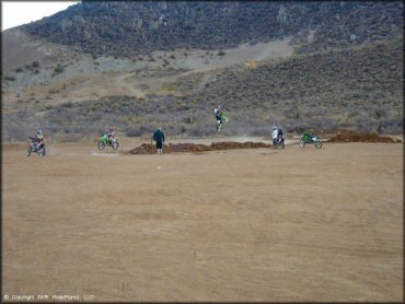 Kawasaki KX Motorcycle jumping at Gardnerville Ranchos Gravel Pits Trail