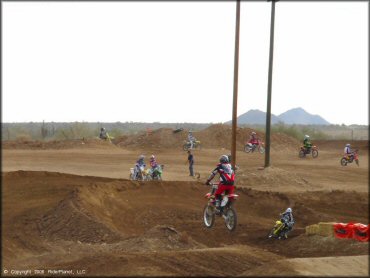 Honda CRF Dirt Bike getting air at Canyon Motocross OHV Area