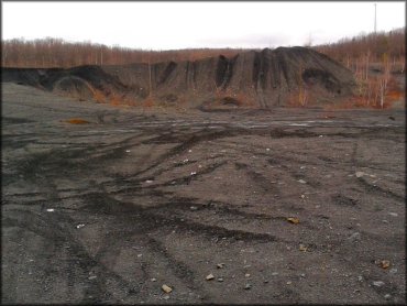 Tall mound of gravel and dirt.