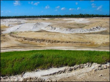 Side view of partially constructed motocross tracks.