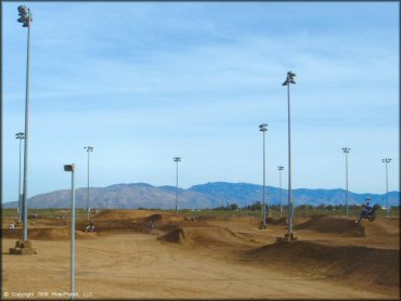 Off-Road Bike getting air at M.C. Motorsports Park Track