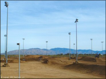 Motorcycle jumping at M.C. Motorsports Park Track