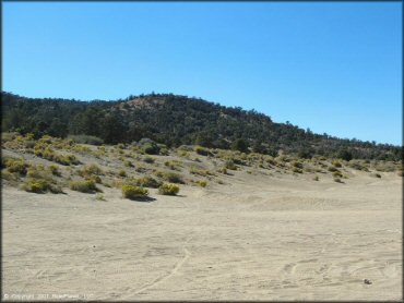 Large open staging area with side trails.