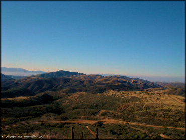 Panoramic view of ATV trails and rolling hills.