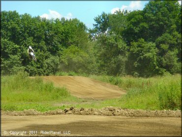 Yamaha YZ Motorcycle catching some air at Connecticut River MX Track
