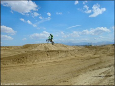 Kawasaki KX Motorcycle catching some air at AV Motoplex Track