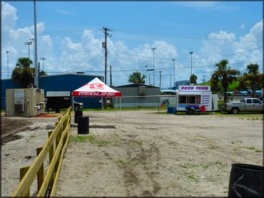 Photo of food truck and registration office in front of main entrance.